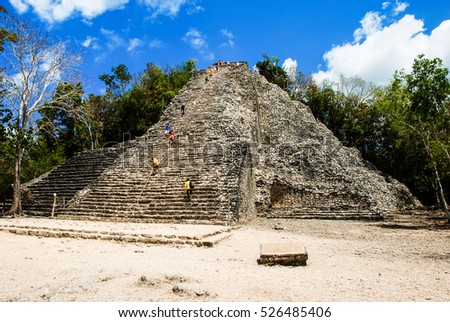 Coba, Mexico. Ancient mayan city in Mexico. Coba is an archaeological area and a famous landmark of Yucatan Peninsula. Cloudy sky over a pyramid in Mexico
