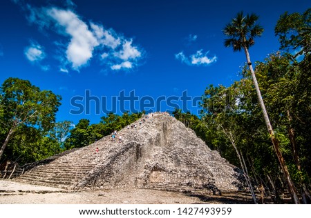Coba, Mexico - November 16, 2010. Archaeological site of Coba with tourist and pyramid