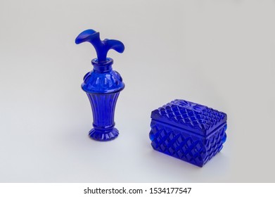 Cobalt Blue Glass Perfume Bottle  And Box Isolated On White Background