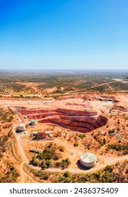 Cobar town copper open pit mine in NSW of Australia - aerial vertical panorama.