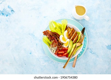 Cobb Salad Bowl Served With Spicy Dressing, Overhead View Of The Meal, Copy Space For A Text