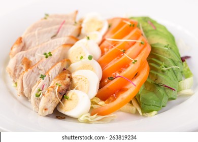 Cobb Salad With Chicken And Eggs Isolated On White Background