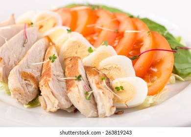 Cobb Salad With Chicken And Eggs Isolated On White Background