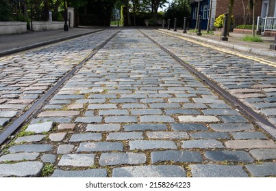 Cobbled stones and tram lines on an old street in England