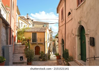 A Cobblestone Alley Through Houses In Morcone, Benevento, Italy