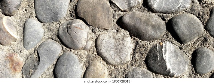The cobblestone on the wall. Background texture