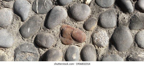 The cobblestone on the wall. Background texture