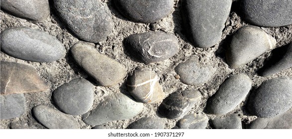 The cobblestone on the wall. Background texture