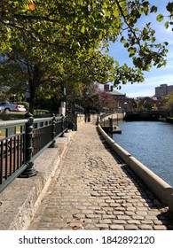 The Cobblestone Path Along The Woonasquatucket River In Waterplace Park In Providence Rhode Island.