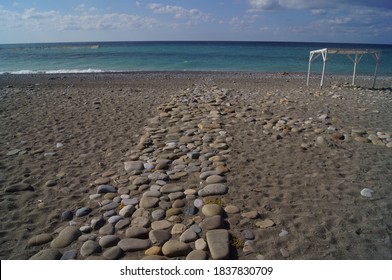 Cobblestone path to the sea.