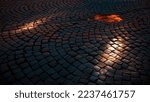 Cobblestone pavement Stone road in the street of old town. Sunlight on cobblestone road in the morning. Old stone texture