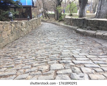 cobblestone road in the park - Powered by Shutterstock - Get 15% off with code: PIKWIZARD15