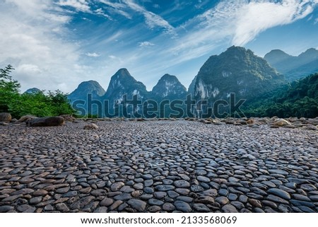 Cobblestone square and beautiful mountain nature scenery in summer