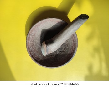 Cobek and pestle, a pair of tools used for pounding, grinding, smoothing certain materials, usually made of real stone, wood and clay, often used to make chili sauce, especially in Indonesia.