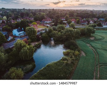 Cobham, Surrey, London, UK - August 20th, 2018: Drone Perspective Of The Small Countryside Town Of Cobham At Sunrise. The Small Town Is Located Near The River And Farmlands Of Surrey. 