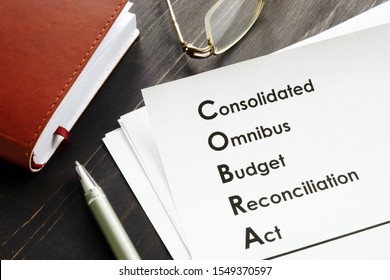 COBRA Consolidated Omnibus Budget Reconciliation Act On The Desk.