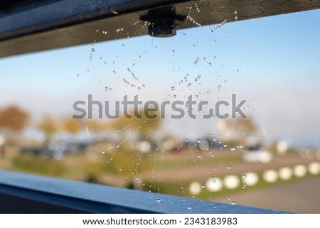 A cobweb between two metalbars