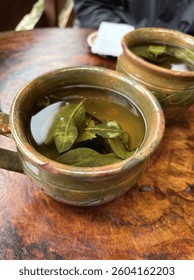 Coca leaf tea to help with the altitude in Ollantaytambo, Peru