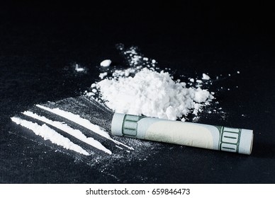 Cocaine divided into paths on a black background