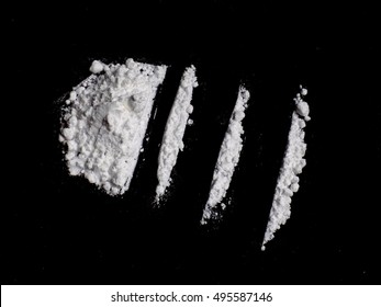 Cocaine Drug Powder Pile And Lines On Black Background