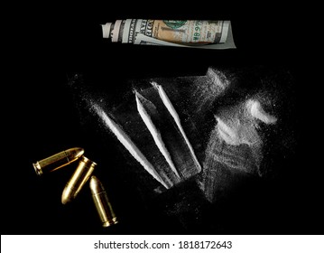 Cocaine line, bullets gun and hundred dollar roll isolated on black background 