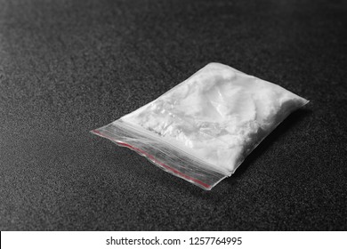 Cocaine In Plastic Bag On Black Background