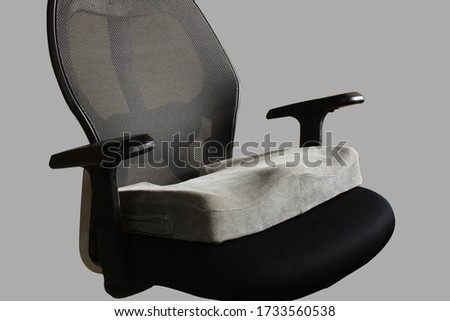 Coccyx seat cushion in office chair