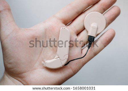 cochlear implant on the arm. hearing aid