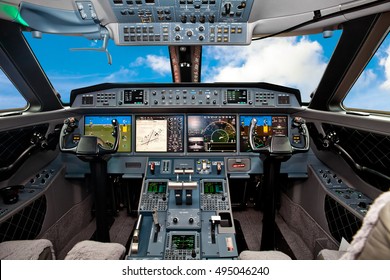 The cockpit of the aircraft with blue sky outside