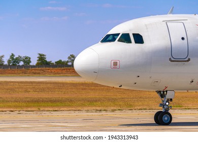 Cockpit Of Big Passenger Airliner On Runway Close Up