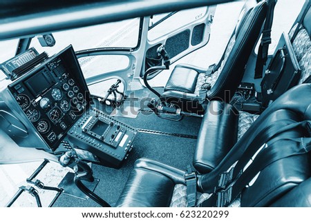 Cockpit helicopter - Instruments panel. Interior of helicopter control dashboard, Heli on the ground. Blue colored