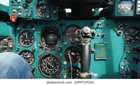 Cockpit of an old Soviet Mig-23 fighter. Close-up of instruments, gauges and controls. Switches, buttons and analogue controls of a decommissioned military aircraft - Powered by Shutterstock