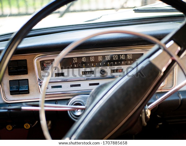 cockpit\
steering wheel and the interior of an old\
car