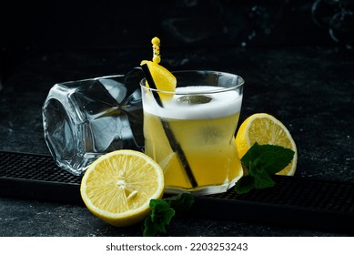 Cocktail. Alcoholic Cocktail With Lemon Liqueur And Lemon Peel In A Glass. Bar Menu.