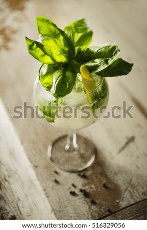 Cocktail with basil leaves