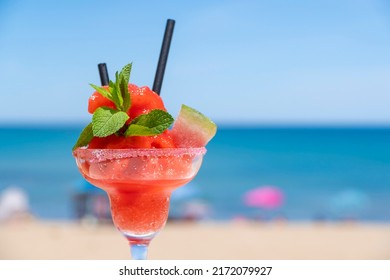 cocktail with beach in background - Shutterstock ID 2172079927