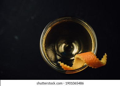 Cocktail In A Beautiful Coupe Glass With Orange Zest. Top View Black Background