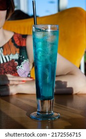 Cocktail Of Blue Curacao Liqueur, Sprite, Ice Cubes In A Tall Glass