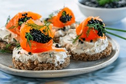 Cocktail Canapes With Smoked Salmon, Cream Cheese And Caviar On Rye Bread - Gourmet Party Food.