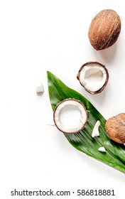 cocktail with coconut on white background top view