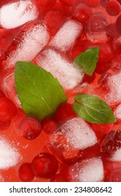 Cocktail With Cranberry Juice And Ice Cubes Close Up Top View.