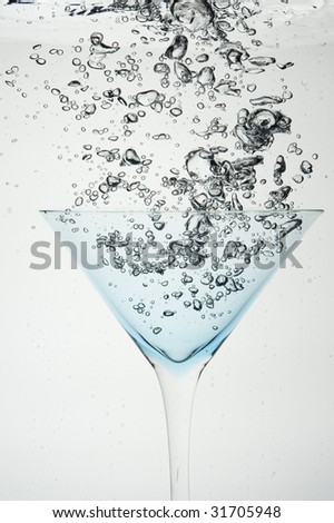 Cocktail and creative splashing.Isolated on white