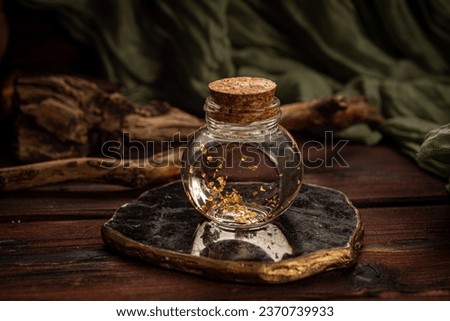 cocktail in the form of a potion for halloween on a wooden background