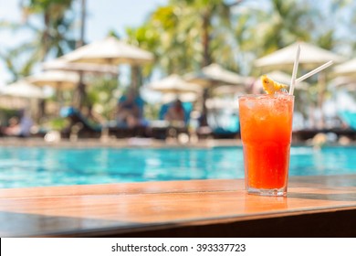Cocktail glasses at pool, beach side.