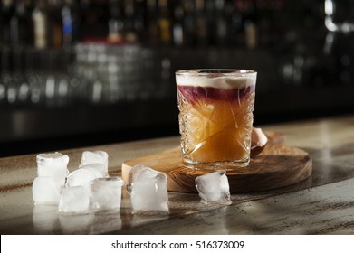 Cocktail With Ice And Egg On A Bar Counter