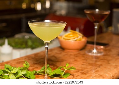 Cocktail Making, Close Up On A Bartender Table With Alcoholic Drinks For A Happy Hour Late Evening. No People Are Visible.