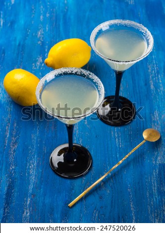 Cocktail in martini glasses on the wooden table
