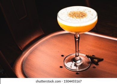 Cocktail On Coupe Glass With Cinnamon Garnish