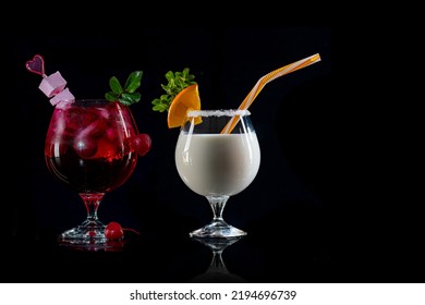 Cocktail Pina Colada, And Cherry Cocktail On An Isolated Black Background. Fresh Drink With Rum, Pineapple Juice, Coconut Milk. Alcoholic Cooler Beverage.