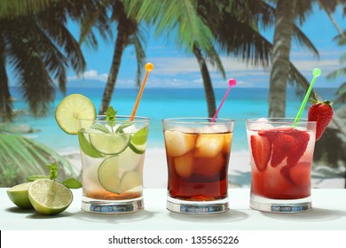 Cocktail Rum And Coke Mojito With Lime Strawberry And Cola On The Beach